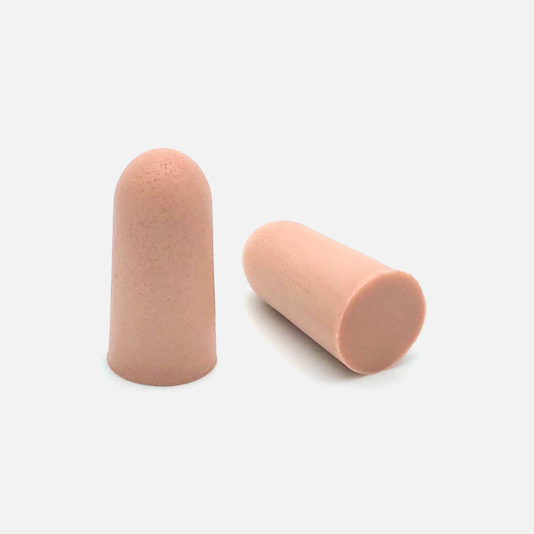 Close-up of Mack's Ultra Soft Foam Earplugs pair showing tapered design for noise reduction and comfort