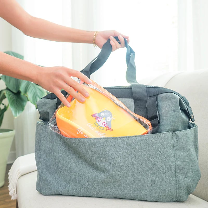 NatureBond silicone baby bibs in yellow and orange with clear waterproof pouch, travel-friendly feeding set for babies and toddlers