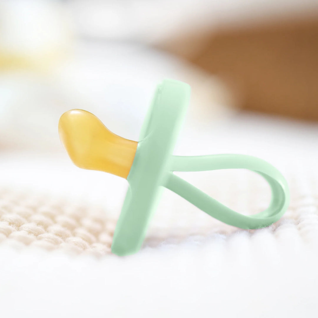 Side view of Natursutten Butterfly Orthodontic Pacifier in Jade Mist, showcasing its ergonomic and natural rubber design.