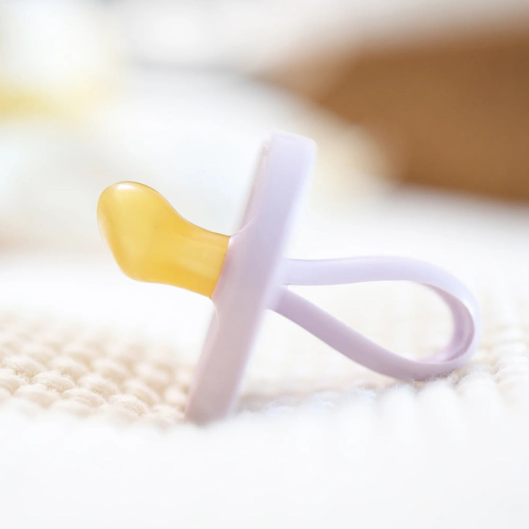 Side view of Natursutten Butterfly Orthodontic Pacifier in Lavender Dreams, showcasing its ergonomic and natural rubber design.