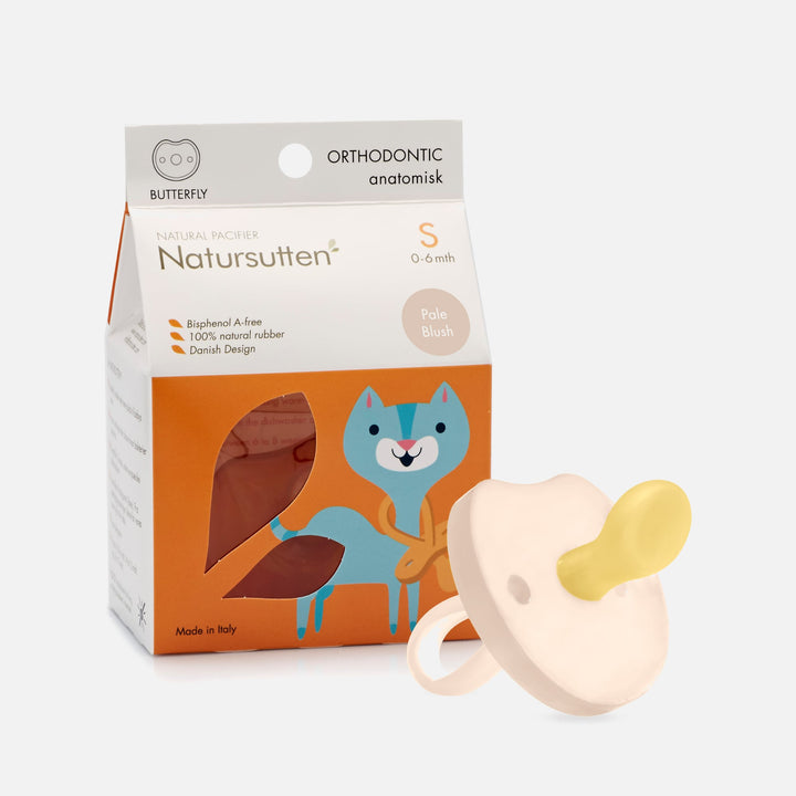 Natursutten Natural Rubber Butterfly Orthodontic Pacifier in Pale Blush with eco-friendly packaging and Danish design.