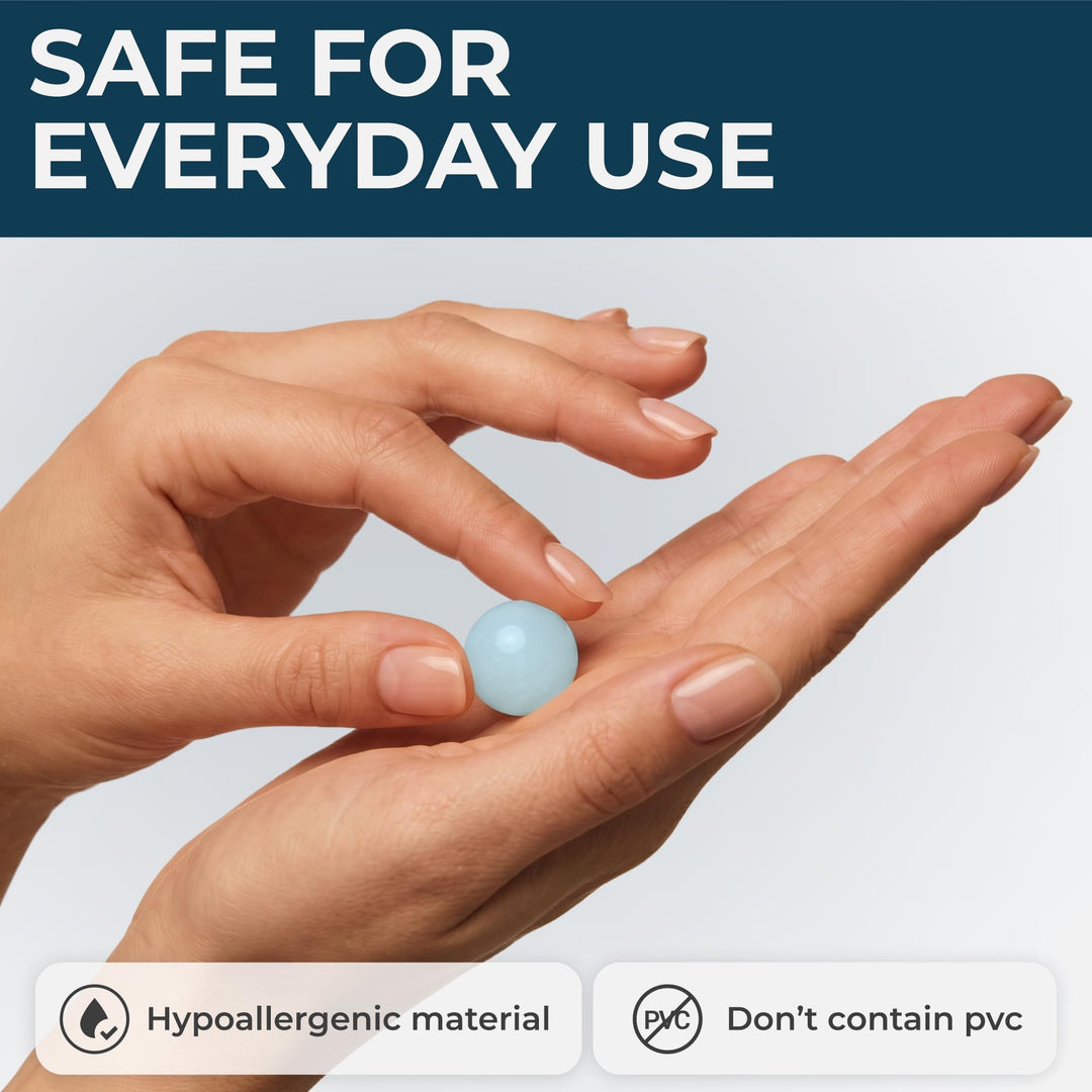 PQ Wax Ear Plugs blue moldable earplug held in the hand, showing its smooth rounded shape