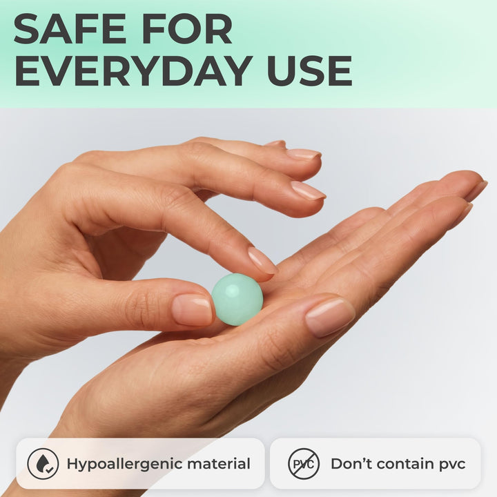 PQ Wax Ear Plugs in green shown between fingers, highlighting the moldable shape, hypoallergenic material and PVC-free formula