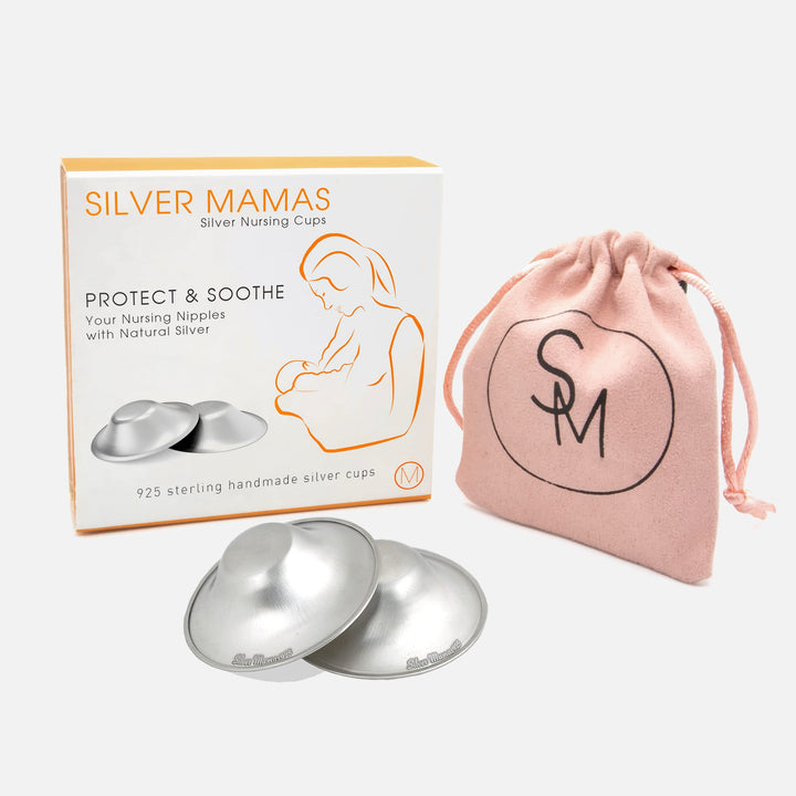 Silver Mamas silver nursing cups with packaging box and pink storage bag, made from 925 sterling silver for nursing moms.