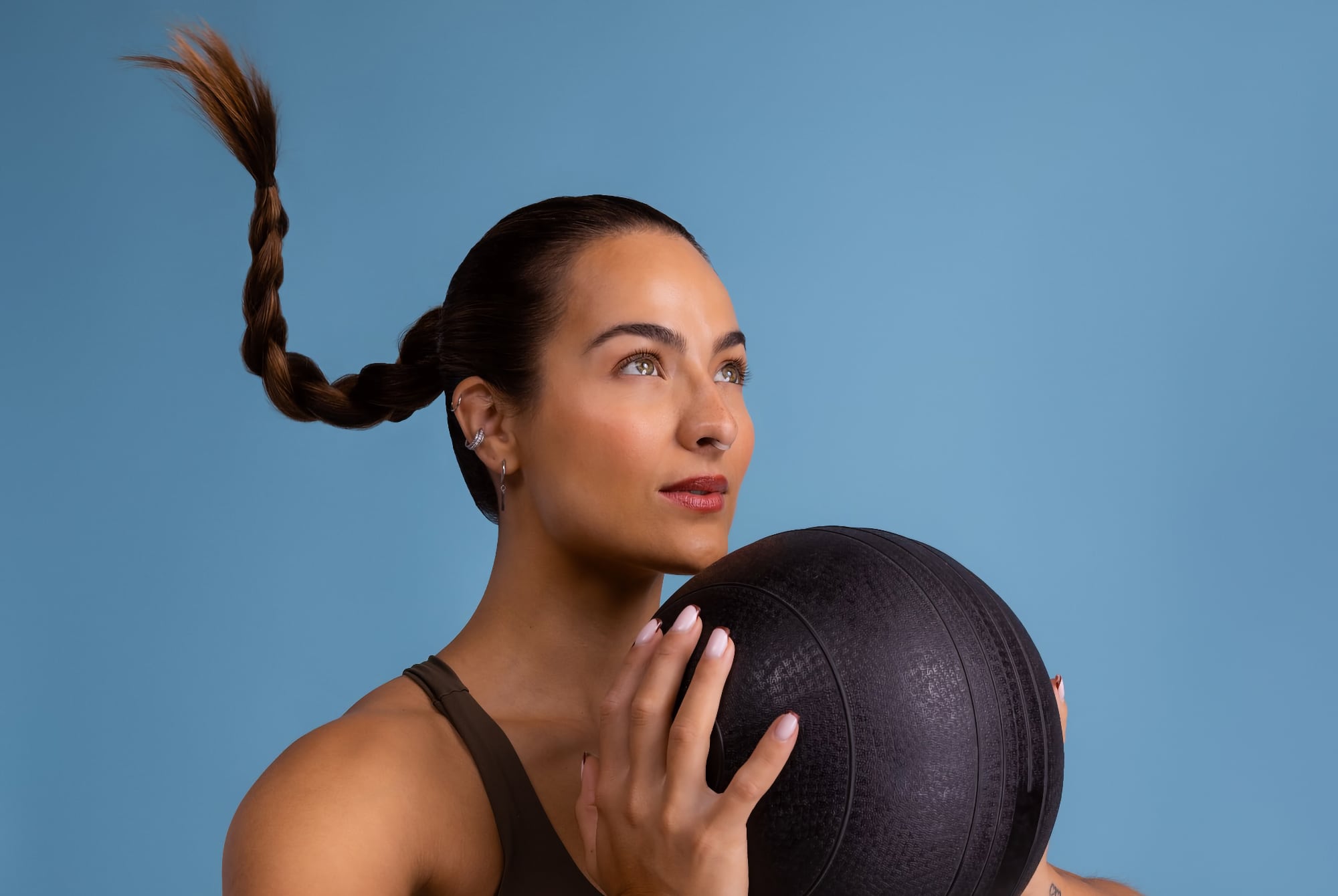 Woman using Airmax Nasal Dilator Sport during workout training for improved breathing performance